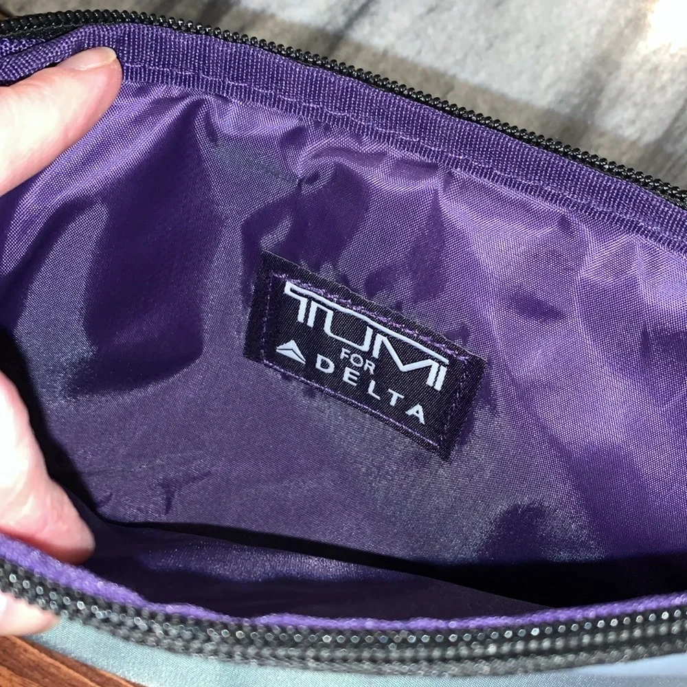 Tumi Purple and Gray Travel Pouches with Socks and sleep masks